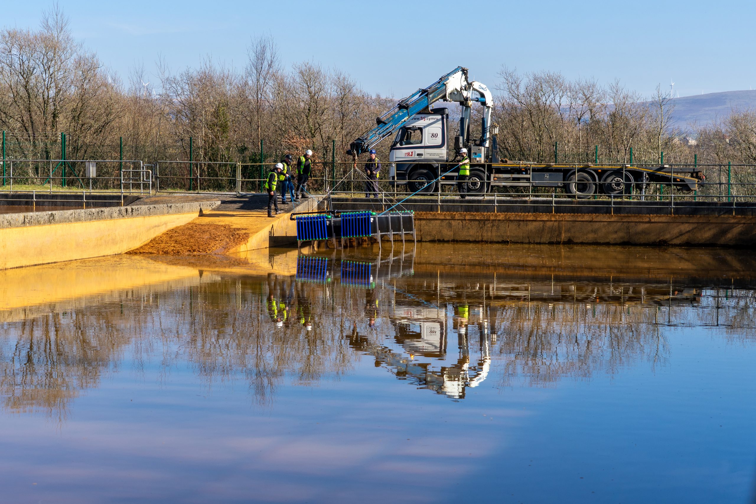 Heat exchangers being installed into the treatment lagoons at Lindsay, Wales