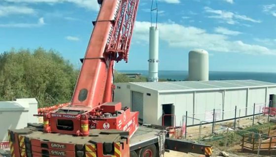 A crane lifts a pre-constructed section into place during the construction of the mine water heat energy centre at Dawdon.