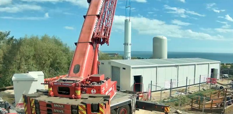 A crane lifts a pre-constructed section into place during the construction of the mine water heat energy centre at Dawdon.